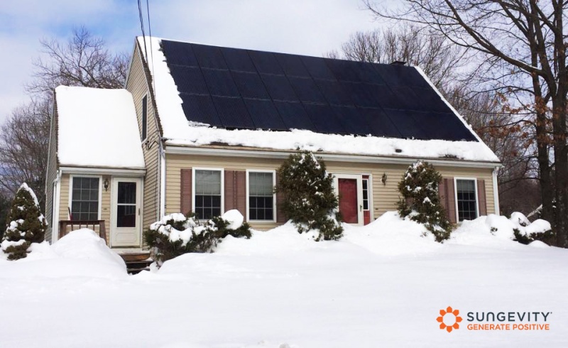 a snowy solar home